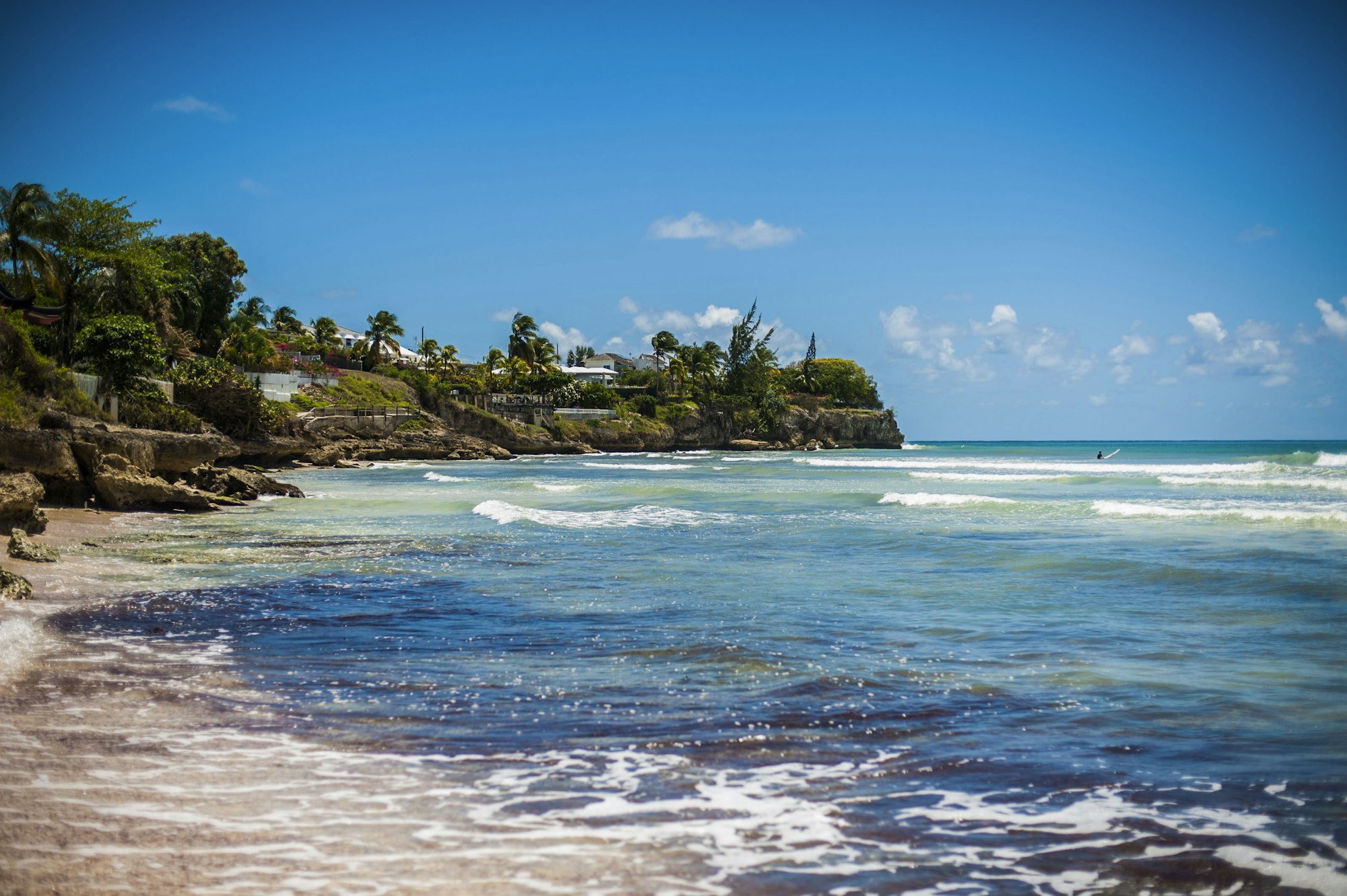 Waves arriving on a sandy Barbados shore